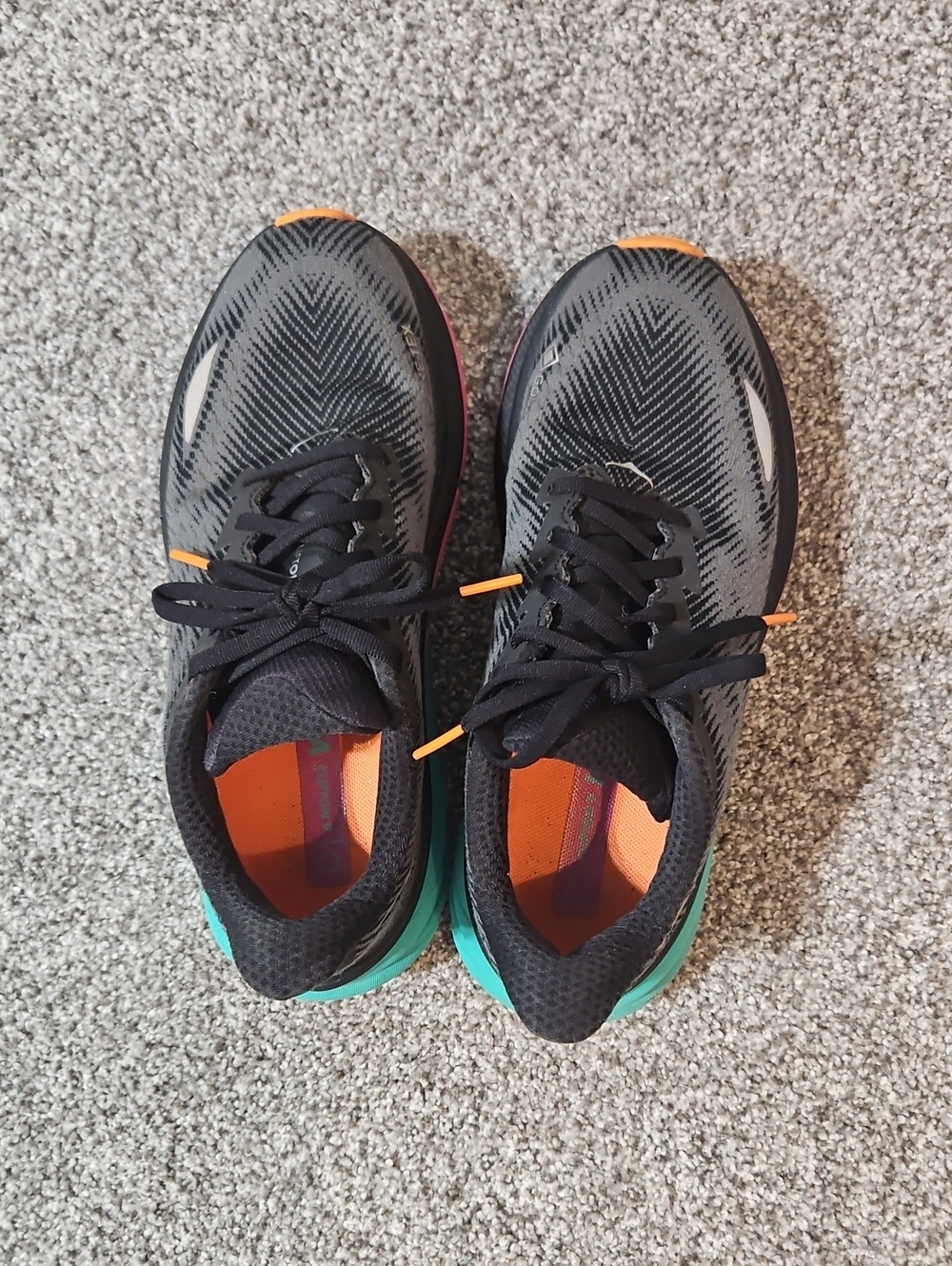 Hoka One One Women's Black Running Shoes with Orange Interior and Teal Heel